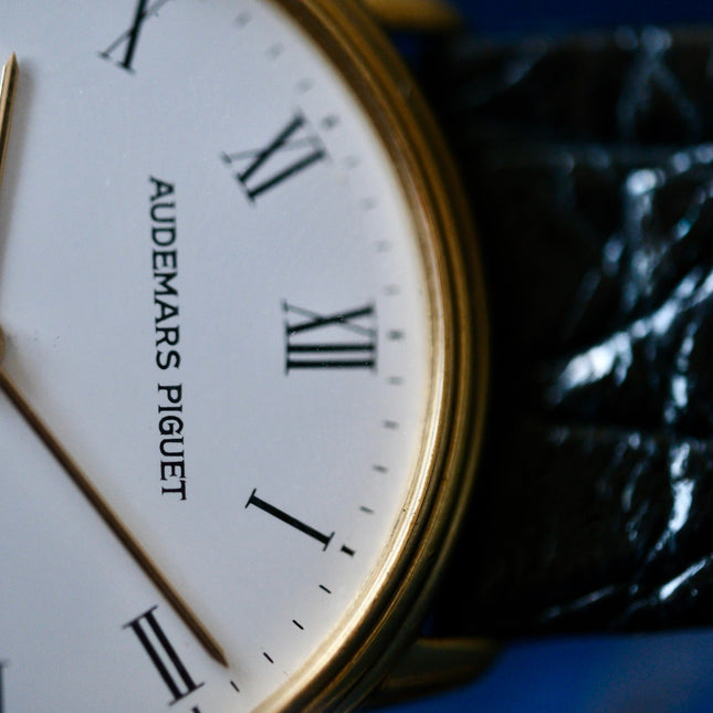 Audemars Piguet Classic 18k gold watch with black strap