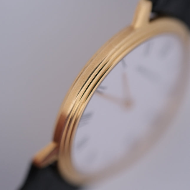 Audemars Piguet Classic 18k gold vintage watch with white face close up
