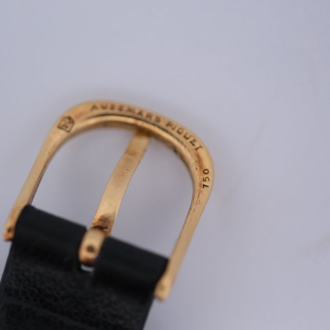 Audemars Piguet Classic 18k gold ring with black leather band