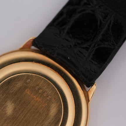 Audemars Piguet Classic 18k gold watch with black leather strap, vintage style