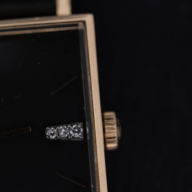Vintage Swiss Omega 14K Square Case Diamond Markers Ring on Black Surface