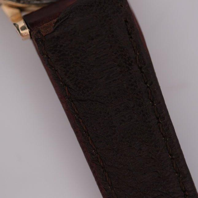 Omega Automatic Bumper watch with gold case and brown leather strap