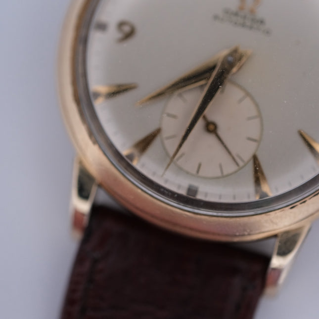 Vintage Omega Automatic Bumper Cal. 354 watch with gold case and leather strap