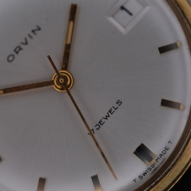 Close up of vintage Orvin 17 Jewels Manual Wind watch with gold case