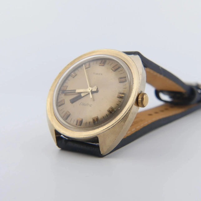 Vintage Timex Electric with Champagne Dial and Leather Band, Swiss Craftsmanship