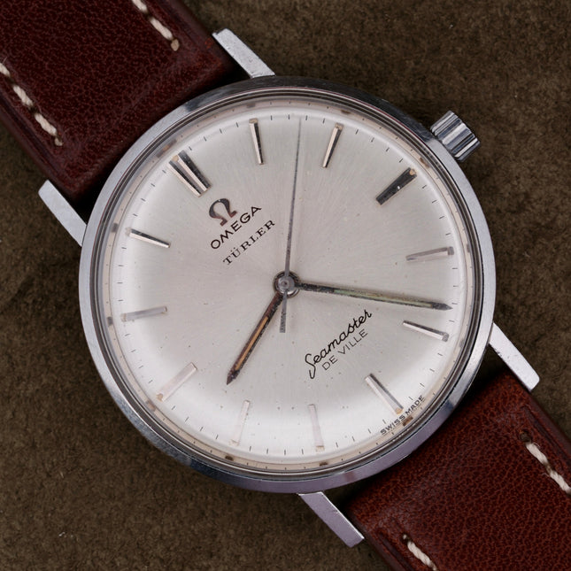 Vintage Swiss watch with white dial and brown leather strap - 1963 Omega Seamaster Deville Türler Dial Ref. 135.010